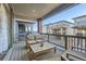 Back porch featuring outdoor furniture including a couch, chairs, and a table with a grill at 15646 W Floyd Dr, Morrison, CO 80465