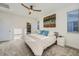 Bedroom featuring a ceiling fan, large bed, and natural light from the window at 15646 W Floyd Dr, Morrison, CO 80465