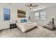 Bright bedroom with neutral tones, a comfortable bed, and plenty of natural light at 15646 W Floyd Dr, Morrison, CO 80465