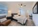 Comfortable bedroom with a ceiling fan, closet, and large window overlooking the exterior at 15646 W Floyd Dr, Morrison, CO 80465