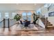 Dining room featuring wood floors, modern lighting, large windows and a contemporary table at 15646 W Floyd Dr, Morrison, CO 80465