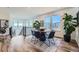 Bright dining area featuring a round table, stylish chairs, and large windows with neighborhood views at 15646 W Floyd Dr, Morrison, CO 80465