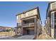 Charming two-story home featuring a balcony, a brick exterior and an attached two car garage at 15646 W Floyd Dr, Morrison, CO 80465