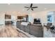 Open concept living space featuring wood floors, modern lighting, and contemporary decor at 15646 W Floyd Dr, Morrison, CO 80465