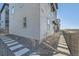 Home exterior featuring decorative rocks, stepping stones, and a fence at 15646 W Floyd Dr, Morrison, CO 80465