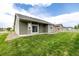 Spacious backyard and home exterior features a well-maintained lawn and modern siding at 268 Naples St, Firestone, CO 80520