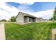 Spacious backyard featuring lush green grass and view of the property at 268 Naples St, Firestone, CO 80520