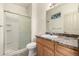 Updated bathroom with shower, tile floors, and spacious vanity at 268 Naples St, Firestone, CO 80520