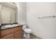 Clean bathroom with a vanity, toilet, and combination shower and bathtub at 268 Naples St, Firestone, CO 80520