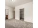 Large bedroom with carpet floors and walk in closet at 268 Naples St, Firestone, CO 80520