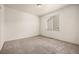 Bright bedroom with neutral carpet, walls, and large window offers a serene living space at 268 Naples St, Firestone, CO 80520