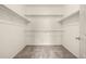 Spacious walk-in closet with carpet floors and built-in shelving at 268 Naples St, Firestone, CO 80520