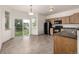 Bright dining area with tile flooring and access to the backyard at 268 Naples St, Firestone, CO 80520