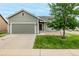 Charming single-Gathering house featuring a well-kept lawn and a two-car garage at 268 Naples St, Firestone, CO 80520