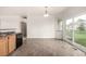 Kitchen eating area has tile floors and a sliding glass door to the backyard at 268 Naples St, Firestone, CO 80520