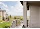 Relax on the balcony overlooking the expansive green space and lake view at 6608 S White Crow Ct, Aurora, CO 80016