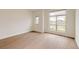 Bedroom with lots of natural light from large windows and hardwood floors at 6608 S White Crow Ct, Aurora, CO 80016