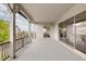 Spacious covered deck with railings, providing an ideal outdoor living and entertaining space at 6608 S White Crow Ct, Aurora, CO 80016