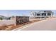 Street-view of the community entrance sign with attractive stone work and landscaping at 6608 S White Crow Ct, Aurora, CO 80016