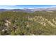Serene aerial view of lush landscapes, showcasing the property's scenic location and natural beauty at 160 Bristlecone Way, Boulder, CO 80304
