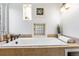 Large soaking tub features tile surround, natural light, and bronze fixtures at 160 Bristlecone Way, Boulder, CO 80304