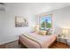 Charming bedroom with wood floors offers a serene atmosphere and natural light at 160 Bristlecone Way, Boulder, CO 80304