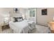 Bright bedroom featuring a comfortable bed, stylish decor, and a window with a serene view at 160 Bristlecone Way, Boulder, CO 80304