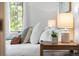 Bright bedroom with large window features neutral decor and wood floors at 160 Bristlecone Way, Boulder, CO 80304