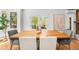 Dining area with wooden table and chairs, large windows offering views of nature and seamless flow to other rooms at 160 Bristlecone Way, Boulder, CO 80304