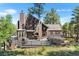 Beautiful home with an expansive deck perfect for entertaining and enjoying the surrounding nature at 160 Bristlecone Way, Boulder, CO 80304