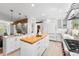 Bright kitchen featuring modern white cabinets, butcher block island, and stainless steel appliances at 160 Bristlecone Way, Boulder, CO 80304