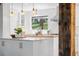 Bright, updated kitchen with white cabinets, butcher block island and stainless steel appliances at 160 Bristlecone Way, Boulder, CO 80304