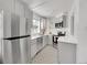 Modern kitchen with stainless steel appliances, bright countertops and a unique geometric tile floor at 215 E 11Th Ave # D8, Denver, CO 80203