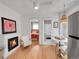 Inviting living area featuring a fireplace and views into the bedroom and bathroom at 215 E 11Th Ave # D8, Denver, CO 80203