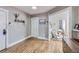 Open living space with hardwood floors, neutral walls, and a view into an adjacent room at 215 E 11Th Ave # D8, Denver, CO 80203