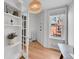 Bright office space featuring hardwood floors, built-in shelving, and a window with neighborhood views at 215 E 11Th Ave # D8, Denver, CO 80203