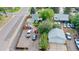 Aerial view of the property with a gravel area, surrounding fence, and a storage container at 103 S Zenobia St, Denver, CO 80219