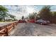 Gravel backyard area featuring wood fence, parked car, and a storage container at 103 S Zenobia St, Denver, CO 80219
