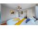 Bright bedroom with soft, natural light; closet with ample storage and hardwood flooring at 103 S Zenobia St, Denver, CO 80219