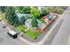 An aerial view of the home showing the manicured lawn and off-street parking with a storage shed at 103 S Zenobia St, Denver, CO 80219