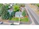 Charming home featuring a well-manicured lawn and a welcoming entrance with a bright blue front door at 103 S Zenobia St, Denver, CO 80219