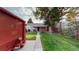 Quaint home with well-maintained lawn and mature tree, offering shade and curb appeal at 103 S Zenobia St, Denver, CO 80219