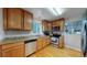 Fully equipped kitchen boasts stainless steel appliances, granite countertops, and ample cabinet space at 103 S Zenobia St, Denver, CO 80219