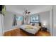 Spacious main bedroom with hardwood floors, natural light, and cozy decor at 103 S Zenobia St, Denver, CO 80219