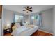 Inviting main bedroom with hardwood floors, ceiling fan, and natural light at 103 S Zenobia St, Denver, CO 80219