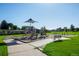 An inviting neighborhood playground offers swings, slides, and climbing features for children of all ages on a sunny day at 5481 E 117Th Ave, Thornton, CO 80233