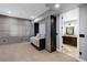 Neutral-toned bedroom featuring a murphy bed and an ensuite bathroom, ideal for guests at 5625 Twilight Way, Parker, CO 80134