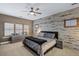 Modern bedroom features a shiplap accent wall, providing a rustic yet contemporary appeal at 5625 Twilight Way, Parker, CO 80134