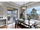 Bright dining area with outdoor access to a deck and lovely views of the landscape at 5625 Twilight Way, Parker, CO 80134