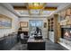 Cozy home office with a fireplace, built-in shelving, and a view of the mountains at 5625 Twilight Way, Parker, CO 80134